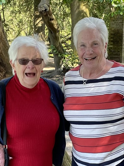 a photo of two ladies who volunteer for Aching Arms